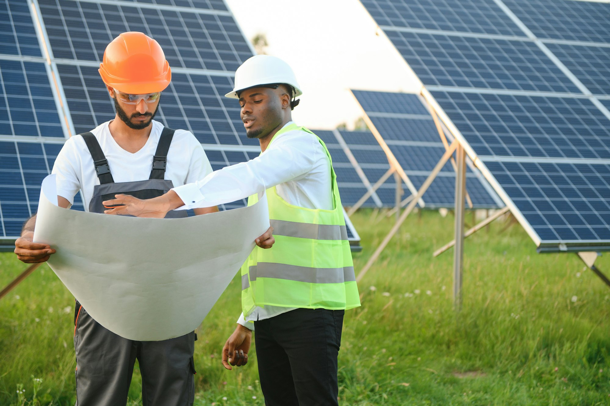 engineer and businessman planing new ecology project. around solar panel roof